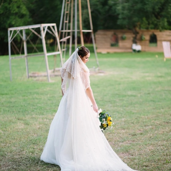 David’s Bridal Ivory Sheer Lace and Tulle Ball Gown Wedding Dress - Picture 5 of 10